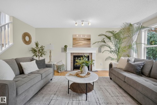 1322 Barnes Close Sw, Edmonton, AB - Indoor Photo Showing Living Room With Fireplace