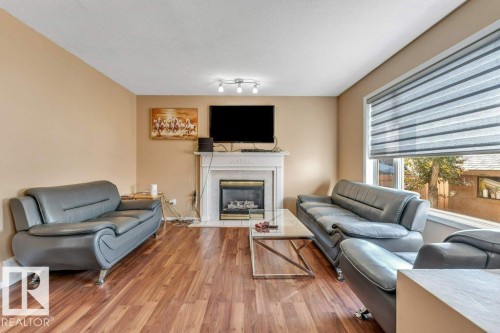 4424 28A Street Nw, Edmonton, AB - Indoor Photo Showing Living Room With Fireplace