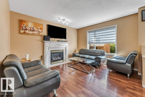 4424 28A Street Nw, Edmonton, AB - Indoor Photo Showing Living Room With Fireplace