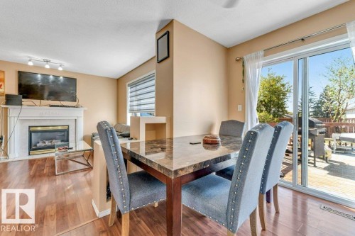 4424 28A Street Nw, Edmonton, AB - Indoor Photo Showing Dining Room With Fireplace
