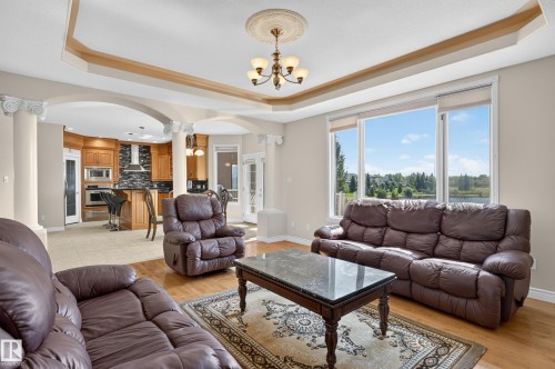 Open concept living area with wood-finish flooring - 13527 158 Avenue Nw, Edmonton, AB - Indoor Photo Showing Living Room