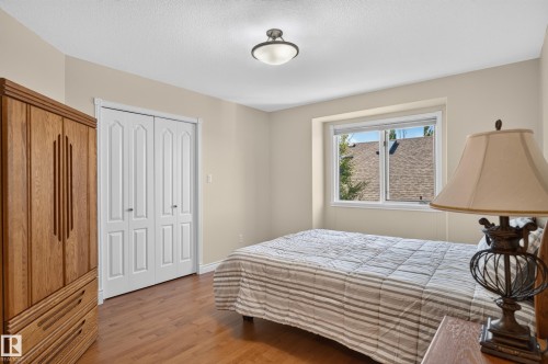 Warm wood-finish flooring - 13527 158 Avenue Nw, Edmonton, AB - Indoor Photo Showing Bedroom