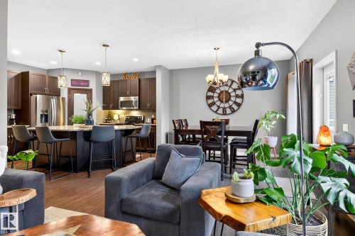 Open-concept living space with wood-finish flooring - 16512 140 Street Nw, Edmonton, AB - Indoor