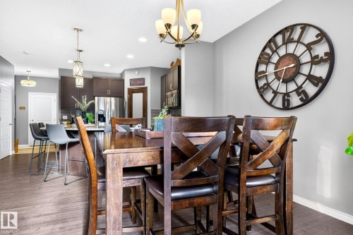 Wood-finish flooring throughout - 16512 140 Street Nw, Edmonton, AB - Indoor Photo Showing Dining Room