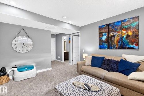 Recessed lighting illuminates neutral gray walls and plush gray carpeting - 16512 140 Street Nw, Edmonton, AB - Indoor Photo Showing Living Room