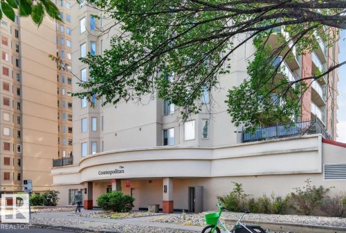 Building exterior featuring a curved facade, prominent entry, and multiple stories with balconies - #1102 10909 103 Av Nw, Edmonton, AB - Outdoor