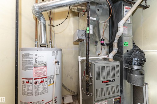 Water heater and furnace systems - 12241 93 Street Nw, Edmonton, AB - Indoor Photo Showing Basement