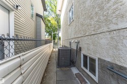 Stucco exterior with a ground-level window - 