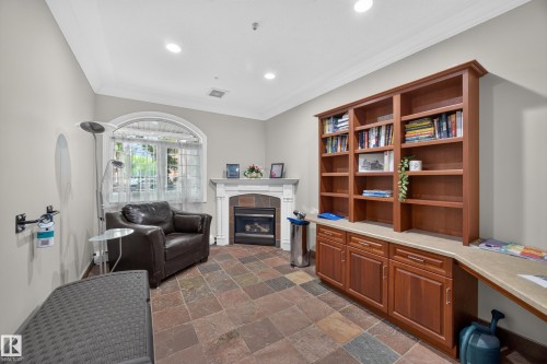 Built-in shelving and cabinetry with an integrated desk area - #401 10178 117 St Nw, Edmonton, AB - Indoor