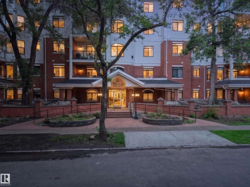Multi-story building with brick and white siding facade - #401 10178 117 St Nw, Edmonton, AB - Outdoor With Facade