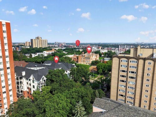 Expansive city skyline featuring various architectural styles and mature tree canopies - #401 10178 117 St Nw, Edmonton, AB - Outdoor