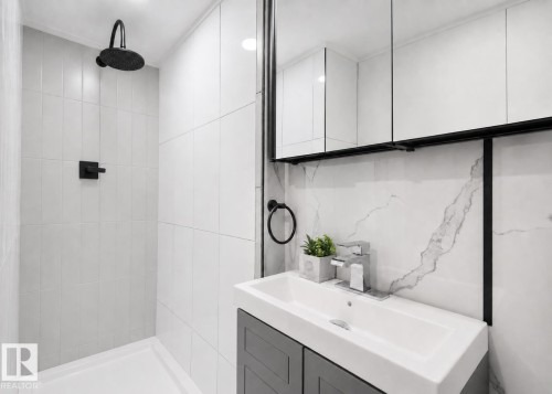 Basement bathroom (AI modified to show the finished cabinet and shower head as will be finished) - 71 Amberly Crest Nw, Edmonton, AB - Indoor Photo Showing Bathroom