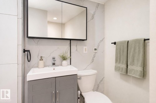 Basement bathroom (AI modified to show the finished cabinet and shower head as will be finished) - 71 Amberly Crest Nw, Edmonton, AB - Indoor Photo Showing Bathroom