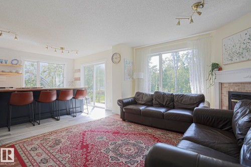 16 La Costa Fairway Close, Stony Plain, AB - Indoor Photo Showing Living Room With Fireplace