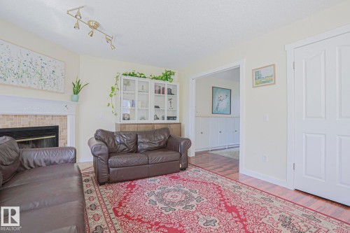 16 La Costa Fairway Close, Stony Plain, AB - Indoor Photo Showing Living Room With Fireplace