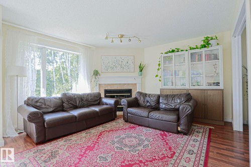16 La Costa Fairway Close, Stony Plain, AB - Indoor Photo Showing Living Room With Fireplace
