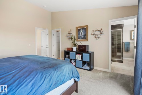 Recessed lighting, light-toned walls, and a full bathroom with a tiled shower stall - 7135 Edgemont Way Nw, Edmonton, AB 