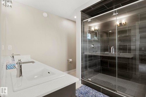 Dual vanity with integrated rectangular sinks and polished chrome fixtures - 7135 Edgemont Way Nw, Edmonton, AB 