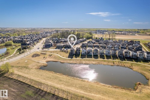 Aerial overview of a residential neighborhood with varied architectural styles - 7135 Edgemont Way Nw, Edmonton, AB 
