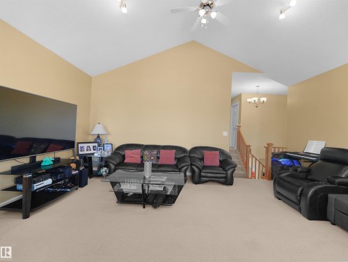 Vaulted ceiling with a ceiling fan and track lighting - 614 Silver Berry Road Nw, Edmonton, AB - Indoor