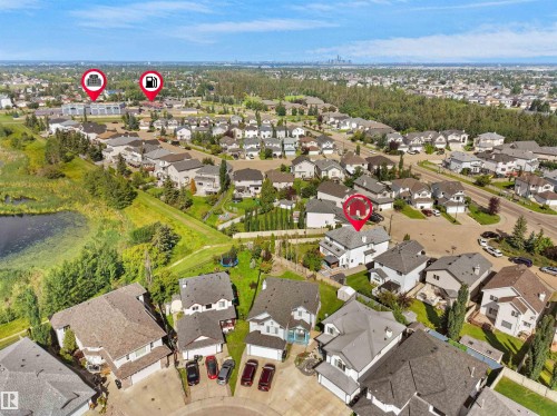 Residential neighborhood with diverse housing styles, surrounding green spaces, and a prominent pond - 614 Silver Berry Road Nw, Edmonton, AB - Outdoor With View