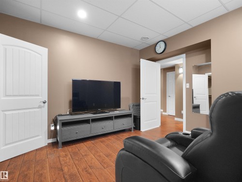Wood-finish flooring, recessed lighting, and a drop ceiling - 614 Silver Berry Road Nw, Edmonton, AB - Indoor