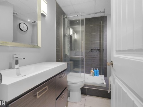 Contemporary vanity with integrated basin and polished chrome faucet - 614 Silver Berry Road Nw, Edmonton, AB - Indoor Photo Showing Bathroom