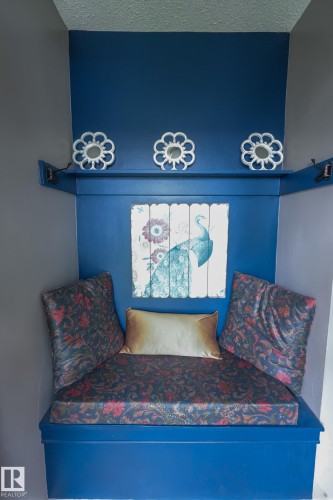 Built-in bench with a richly patterned cushion and coordinating backrests - 11739 129 Street Nw, Edmonton, AB 