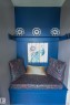 Built-in bench with a richly patterned cushion and coordinating backrests - 11739 129 Street Nw, Edmonton, AB 