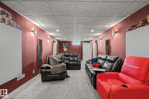 Recessed ceiling lighting, wall-mounted sconces, carpeted flooring, finished ceiling, and painted walls - 4323 114B Street Nw, Edmonton, AB - Indoor