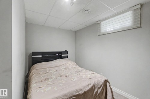Wall-to-wall carpeting and a drop ceiling with recessed lighting - 4323 114B Street Nw, Edmonton, AB - Indoor Photo Showing Bedroom