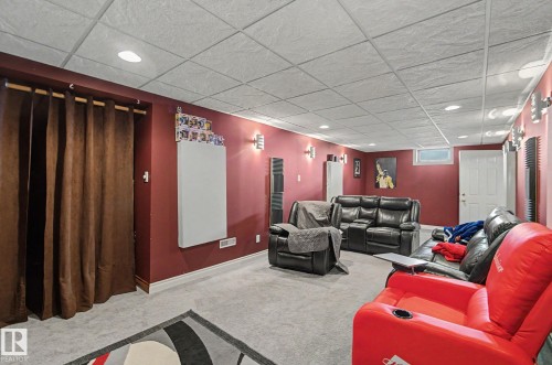 Recessed lighting, wall sconces, drop ceiling, window, and wall-to-wall carpeting - 4323 114B Street Nw, Edmonton, AB - Indoor
