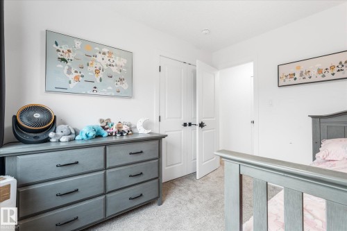 White walls, light-toned carpeting, and a built-in closet with white doors - 9 Dillingham Avenue, Fort Saskatchewan, AB - Indoor
