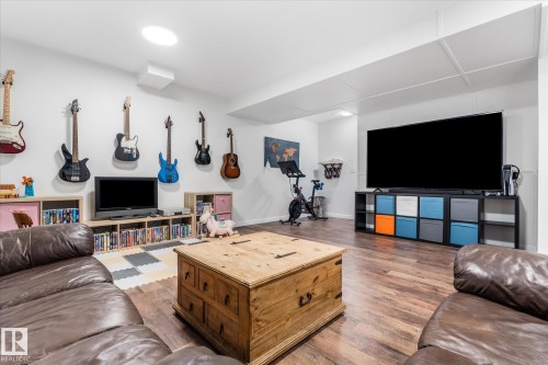 Wood-finish flooring throughout - 9 Dillingham Avenue, Fort Saskatchewan, AB - Indoor Photo Showing Living Room