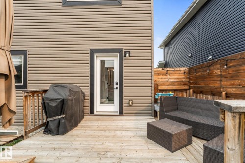 Expansive outdoor deck featuring wood flooring and a wooden railing - 9 Dillingham Avenue, Fort Saskatchewan, AB - Outdoor With Deck Patio Veranda With Exterior