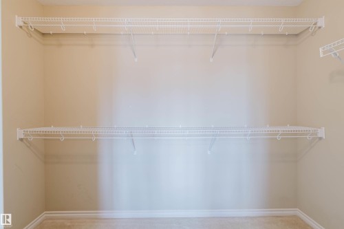 Built-in wire shelving system with multiple tiers - 864 Armitage Wynd Sw, Edmonton, AB - Indoor With Storage
