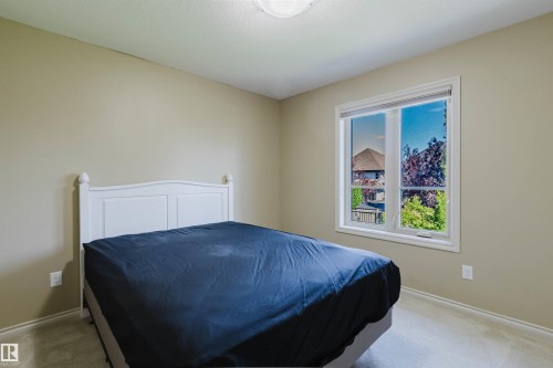 Neutral wall finishes and light-colored carpeting - 864 Armitage Wynd Sw, Edmonton, AB - Indoor Photo Showing Bedroom