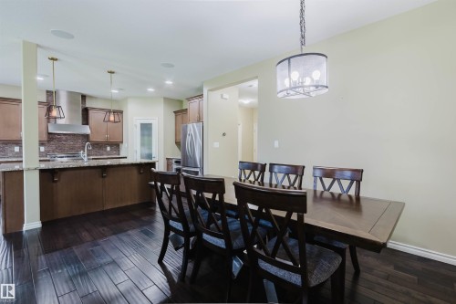 Hardwood-style flooring throughout - 864 Armitage Wynd Sw, Edmonton, AB - Indoor Photo Showing Other Room