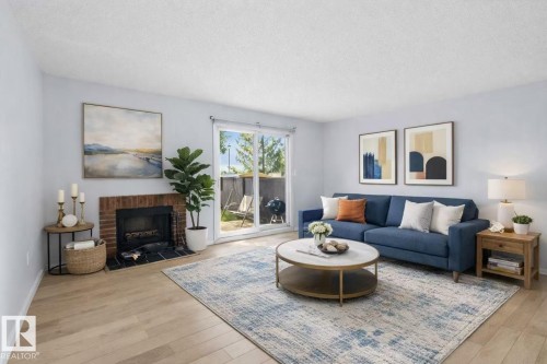 117 Tudor Lane Nw, Edmonton, AB - Indoor Photo Showing Living Room With Fireplace