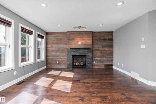 1103 115 Street Sw, Edmonton, AB - Indoor Photo Showing Living Room With Fireplace
