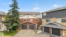Multi-level townhome featuring a double garage, brown brick facade, and brown siding - 10644 158 Avenue Nw, Edmonton, AB  - Outdoor 
