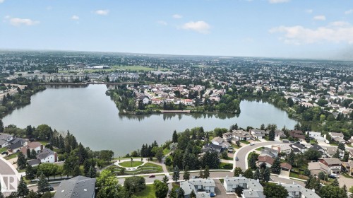 Expansive aerial perspective showcasing a residential community - 10644 158 Avenue Nw, Edmonton, AB - Outdoor With Body Of Water With View