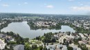 Expansive aerial perspective showcasing a residential community - 10644 158 Avenue Nw, Edmonton, AB  - Outdoor With Body Of Water With View 