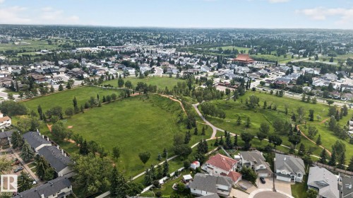 Expansive green spaces featuring walking paths, mature trees, and residential areas - 10644 158 Avenue Nw, Edmonton, AB - Outdoor With View