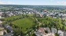 Expansive green spaces featuring walking paths, mature trees, and residential areas - 10644 158 Avenue Nw, Edmonton, AB  - Outdoor With View 
