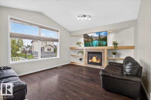 31 Haney Landing, Spruce Grove, AB - Indoor Photo Showing Living Room With Fireplace