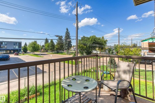 Outdoor concrete patio with metal railings - 15713 102 Avenue Nw, Edmonton, AB - Outdoor With Balcony