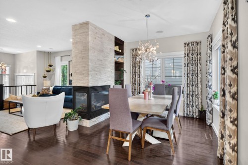2327 Frezenberg Avenue Nw, Edmonton, AB - Indoor Photo Showing Dining Room With Fireplace