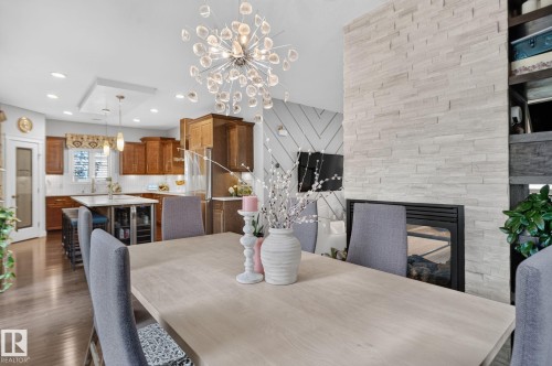 2327 Frezenberg Avenue Nw, Edmonton, AB - Indoor Photo Showing Dining Room With Fireplace