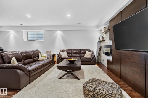 2327 Frezenberg Avenue Nw, Edmonton, AB - Indoor Photo Showing Living Room With Fireplace